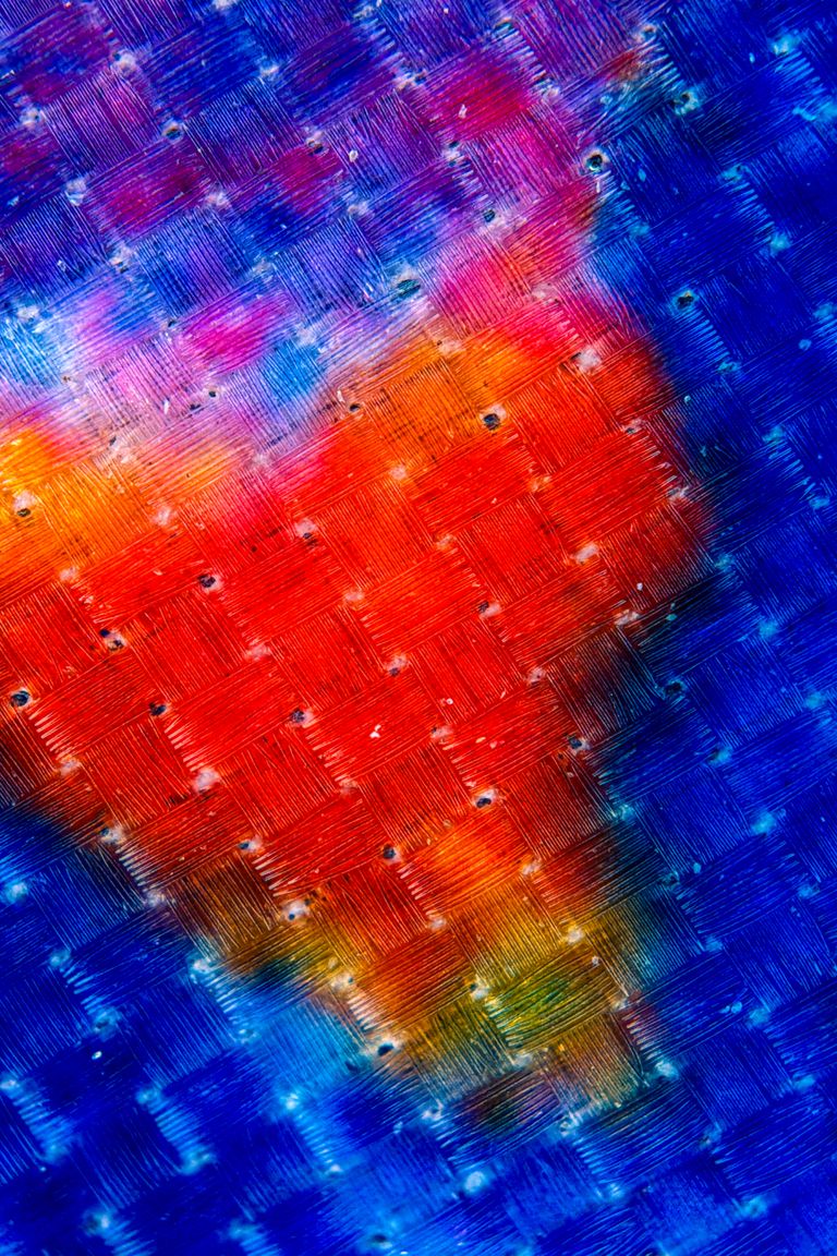 Colorful abstract painting with a heart shape in vibrant hues.